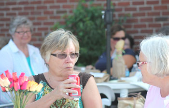 Susan Arnold Sipping Soda and talking with Beverly Ingram