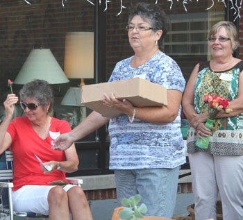 Teresa Winkler accepts handmade rose from_Jo Woodward and Susan Arnold